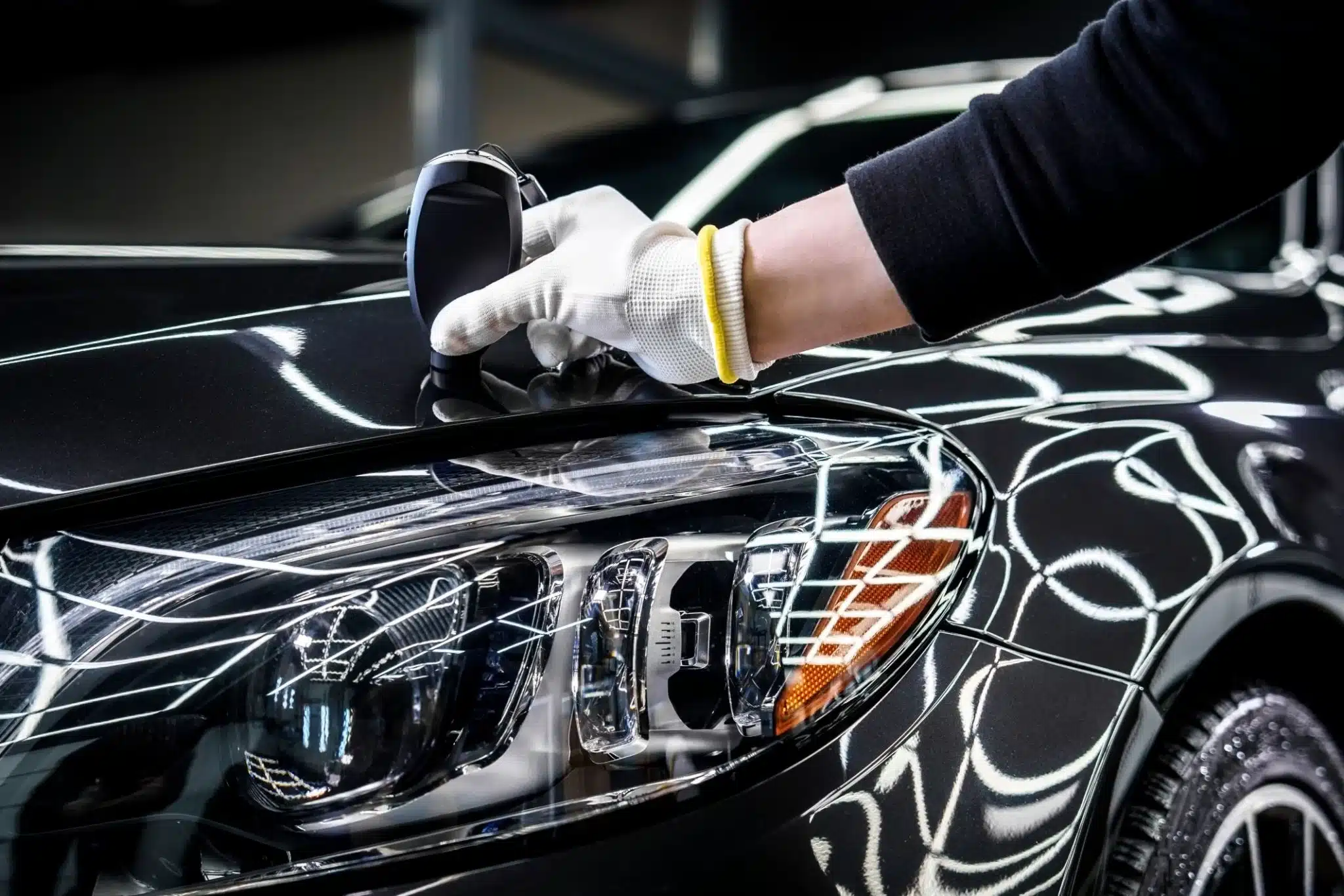 Pre-Sale Car Detailing Sydney | Increase Your Car's Value 166 Professional technician carefully applying paint protection coating to car surface with precision, showcasing attention to detail and expertise