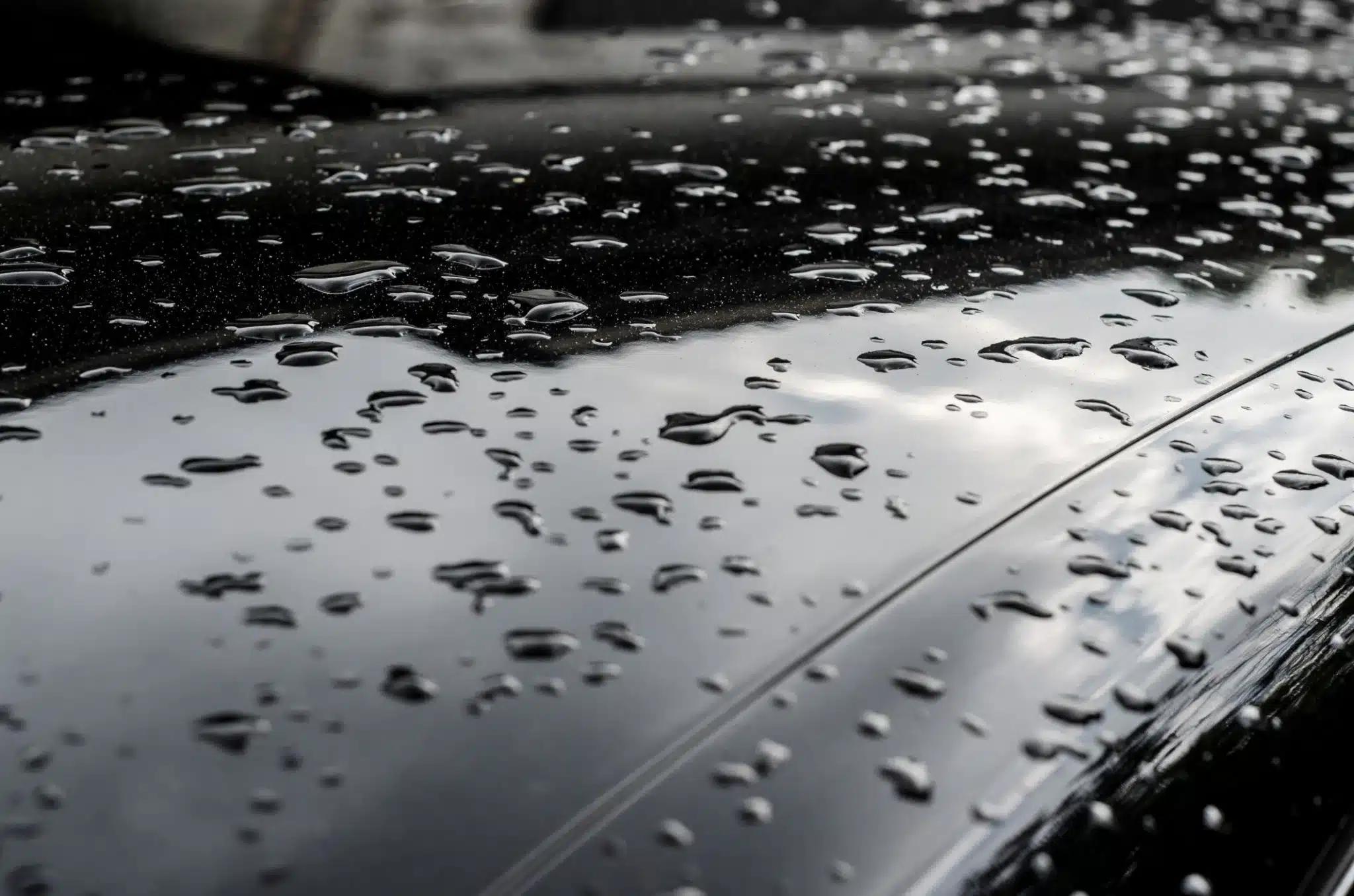 Water beading off a freshly dressed engine cover, showing the protective dressing at work.
